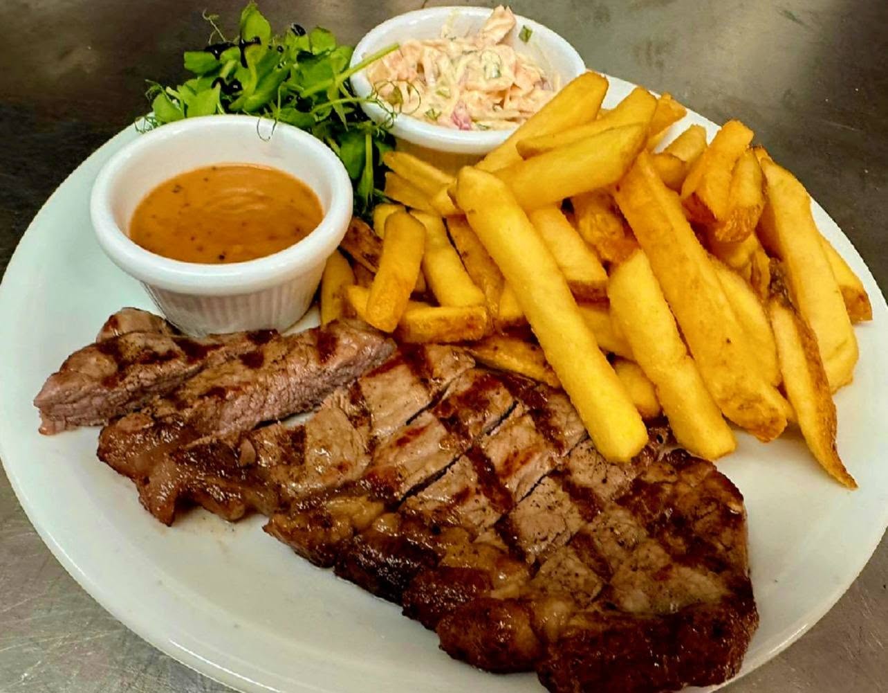 Steak frites with chips, slaw and peppercorn sauce, photographed by The Moon & Sixpence